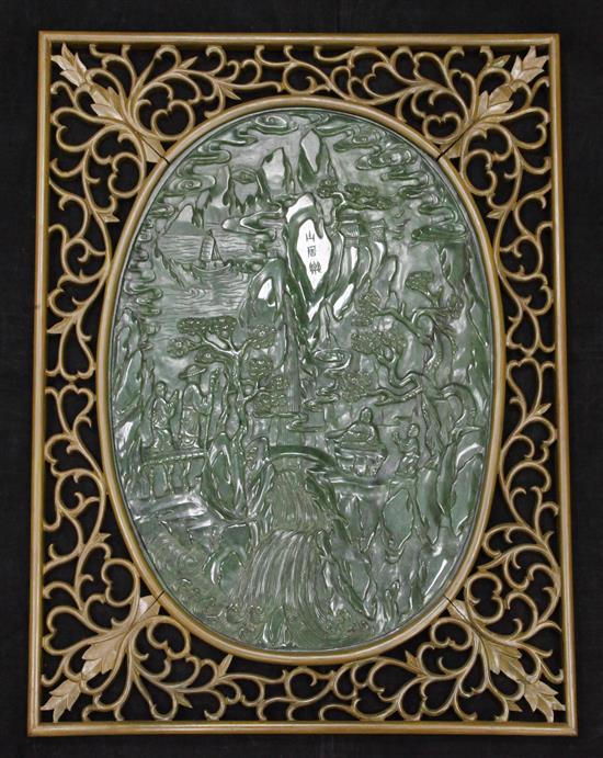 A large Chinese spinach green jade and wood table screen panel, 20th century, total size including wood frame 67 x 53cm, stand lacking